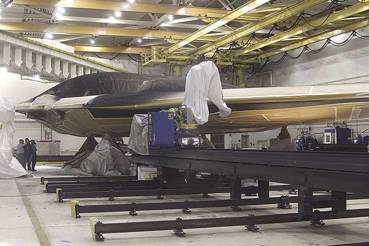 Rare photo of B-2 receiving anti-radar material (Northrop-Grumman)