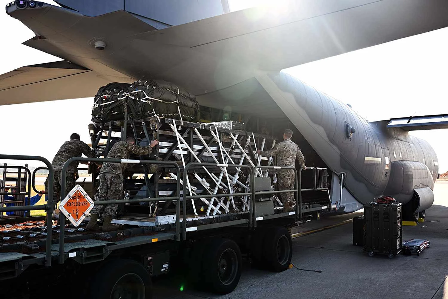 Palletized ammunition being loaded onto a C-130 Hercules (USAF)